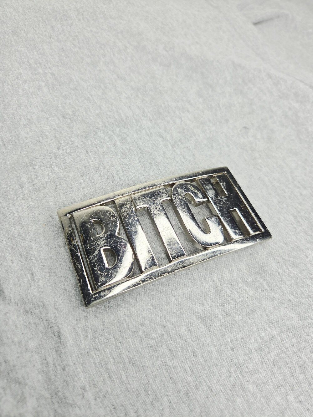 Vintage 1970s Chrome Cutout Word Novelty Belt Buckle